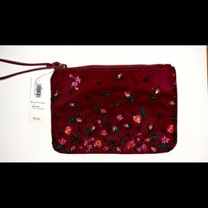 NEW  Maroon velvet wristlet with roses on on the front of it!